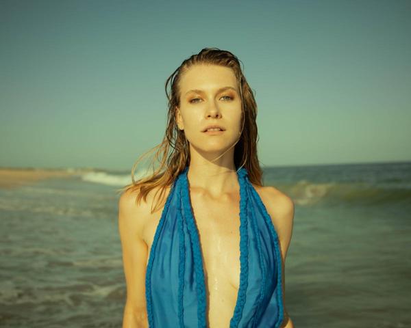 Close-up of Caucasian model with wet hair on the beach photographed by Marty Gottlieb